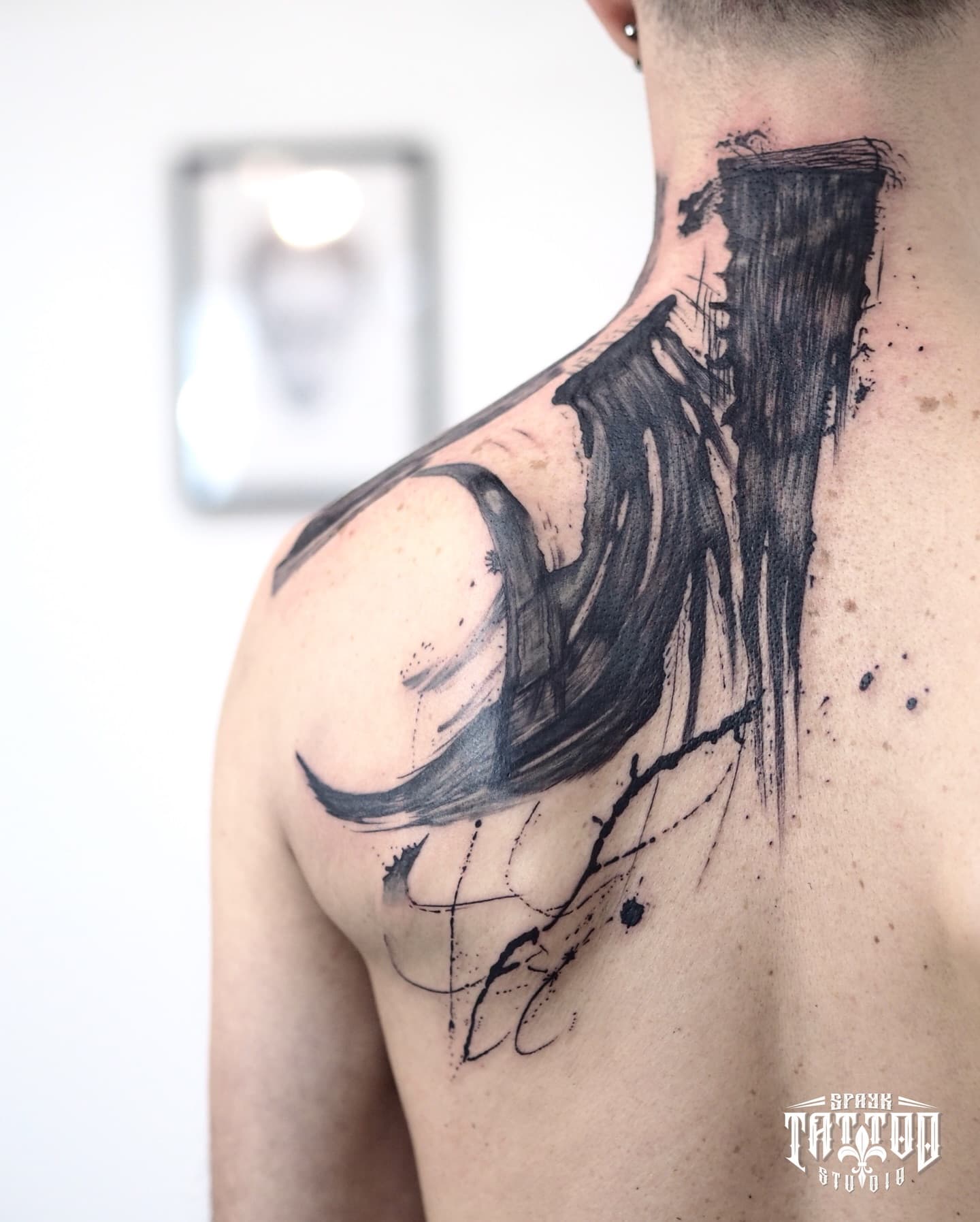 Abstract brushstroke blackwork on neck and shoulder