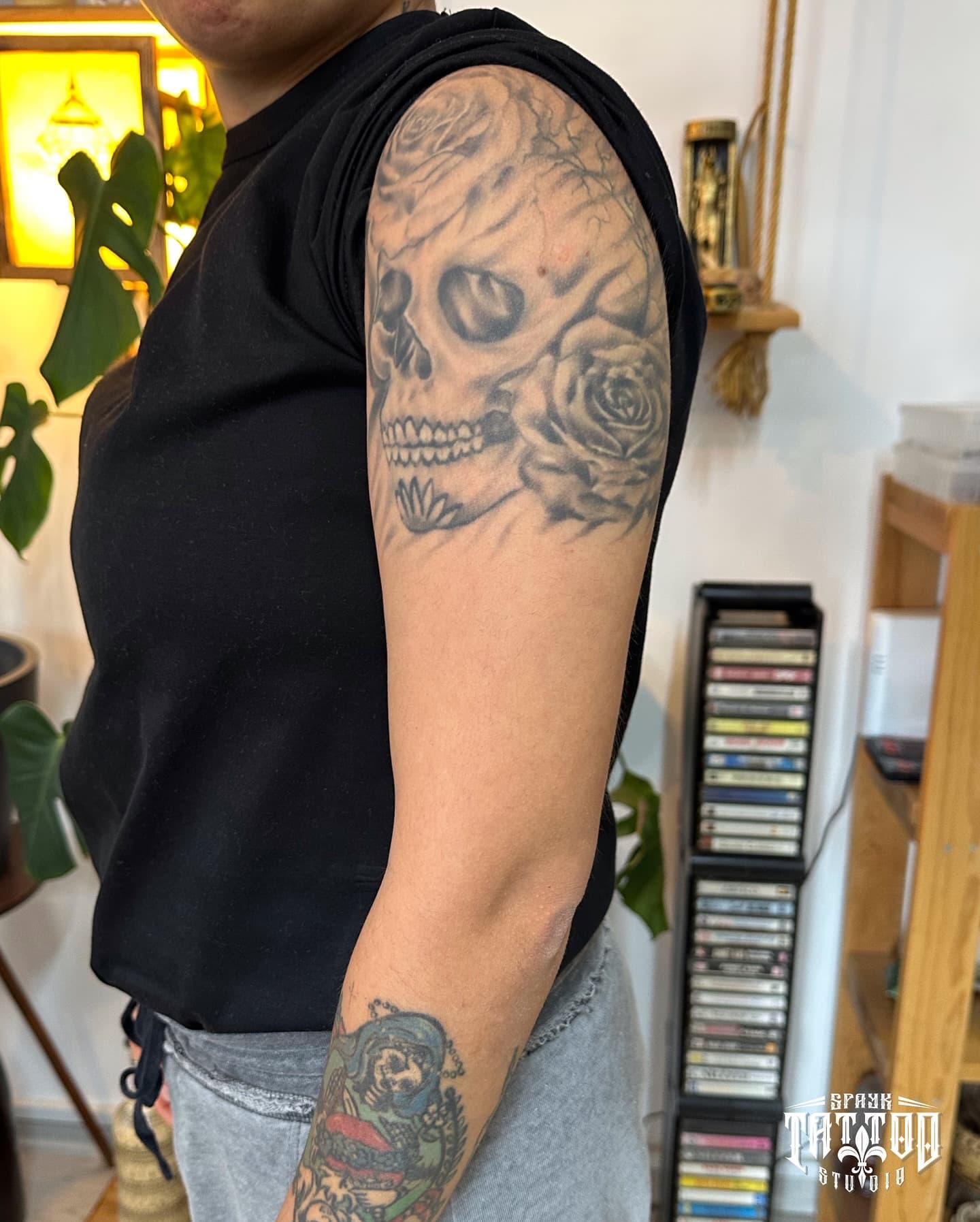 Cover-up before — original tattoo on upper arm