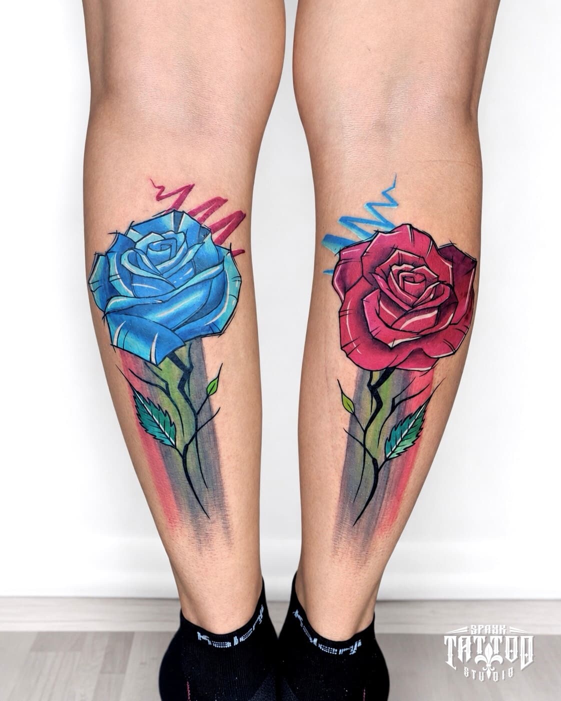 Matching colorful rose calf tattoos