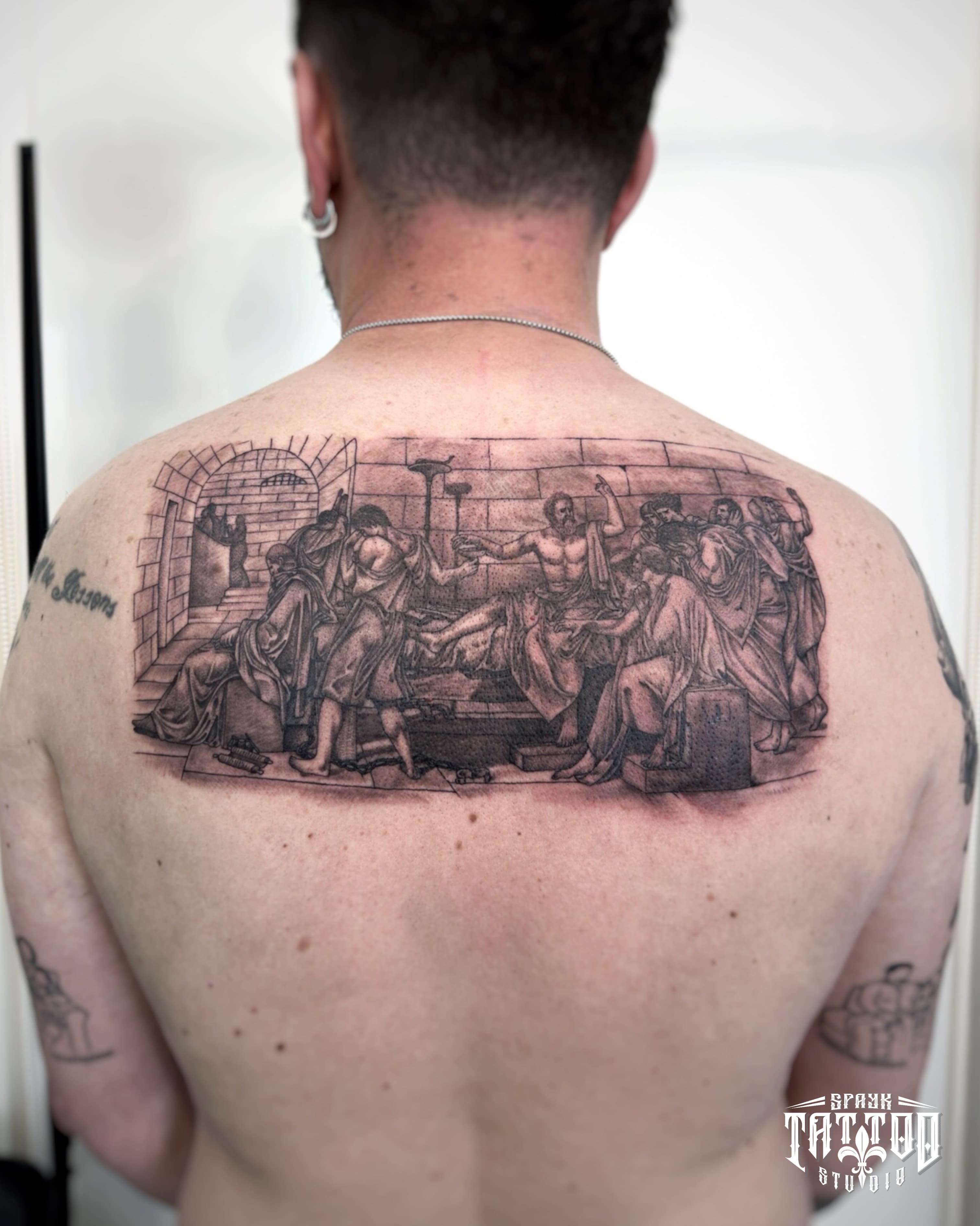 The Death of Socrates back tattoo in black and grey realism