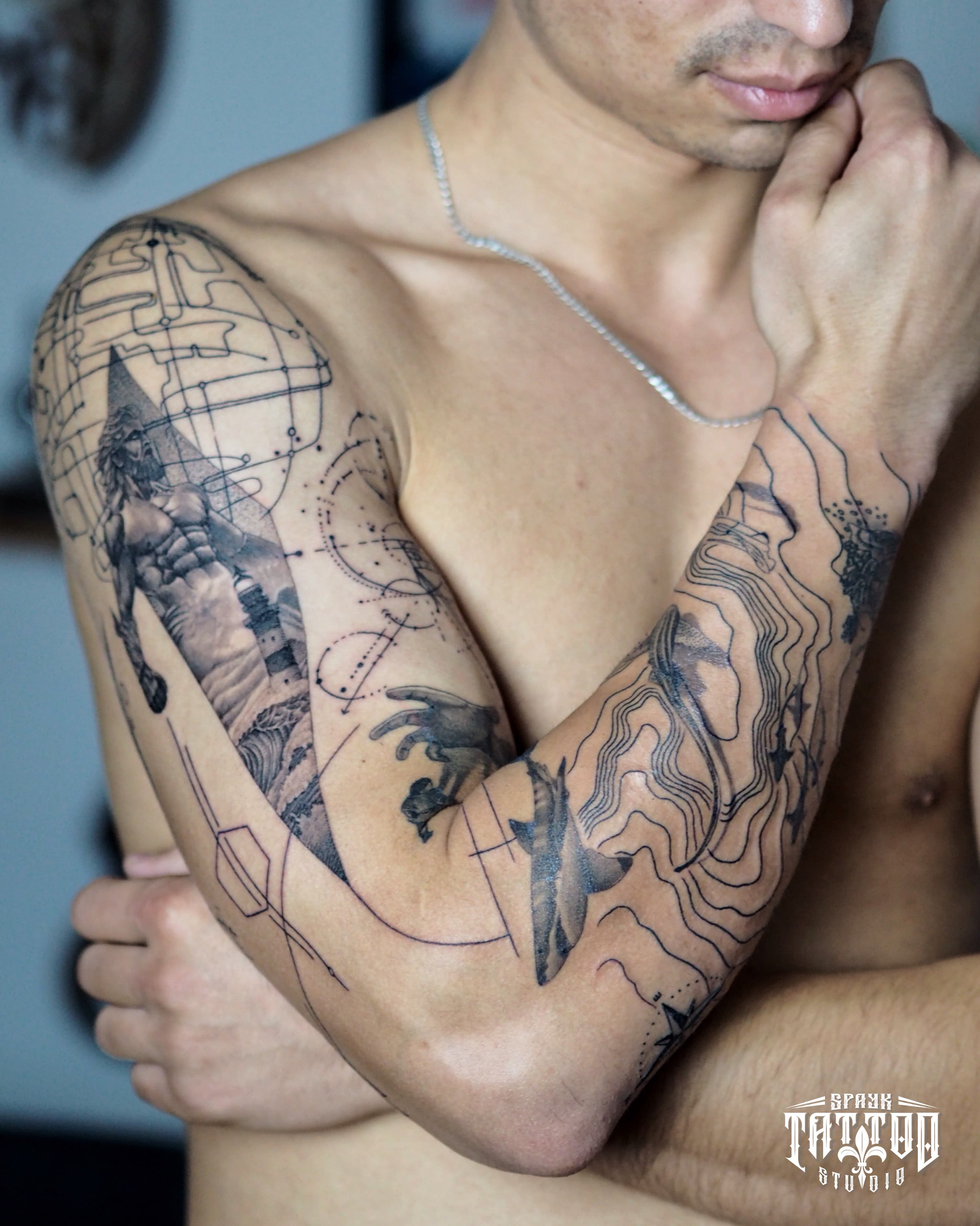 Geometric realism arm sleeve with sharks and lighthouse