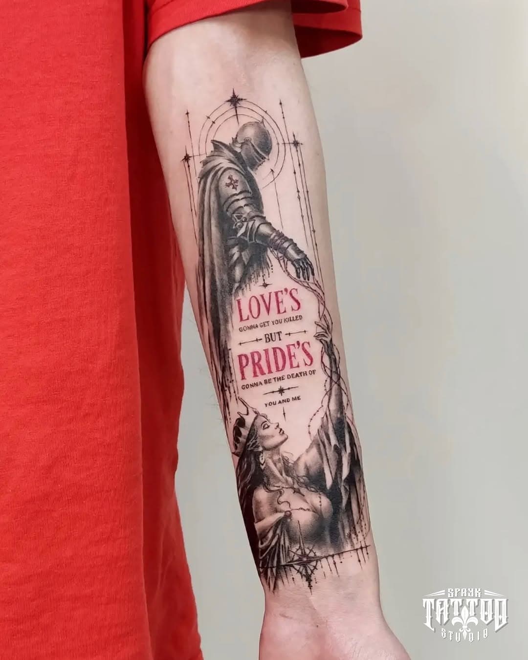 Illustrative knight and lettering forearm tattoo